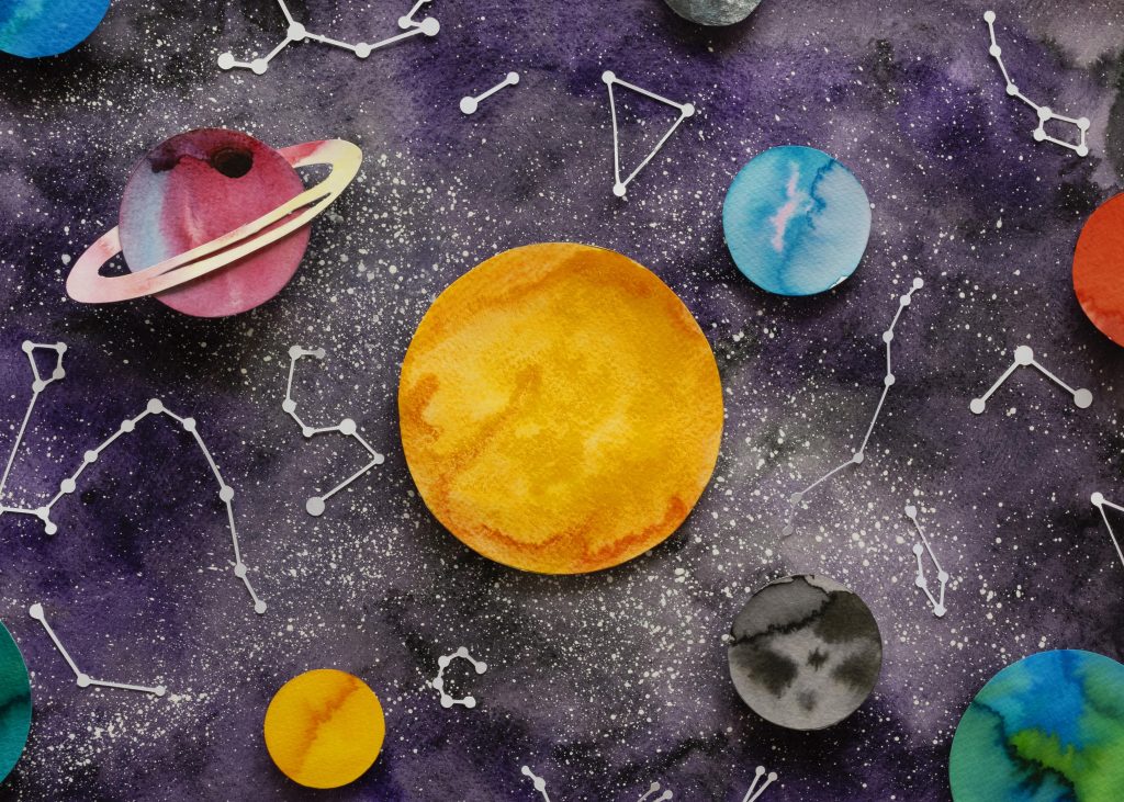 Kolorowa ilustracja układu słonecznego z planetami i gwiazdami.