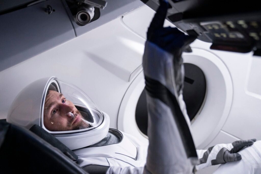Astronaut in a spacecraft cockpit