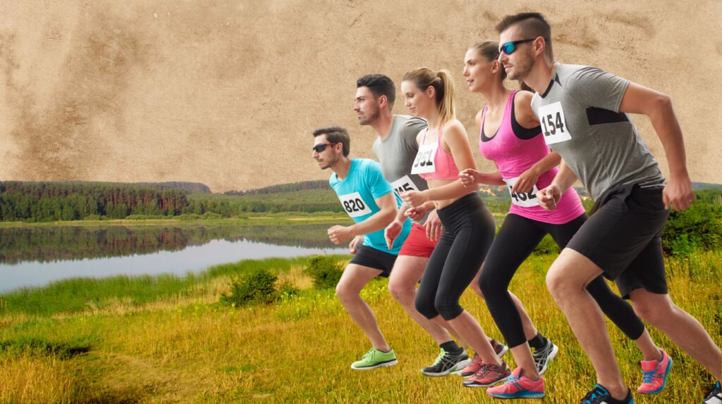 Grupa biegaczy startujących w wyścigu na tle jeziora