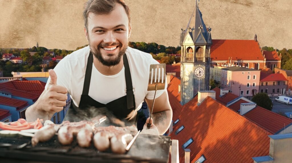 Mężczyzna grilluje na dachu z widokiem na miasto.