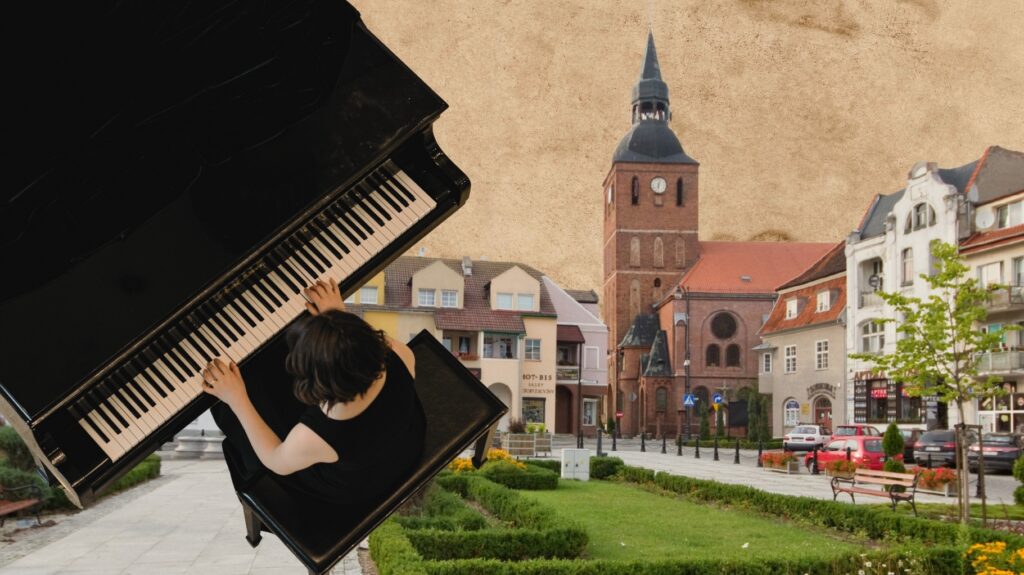 Osoba grająca na fortepianie na tle miasta.