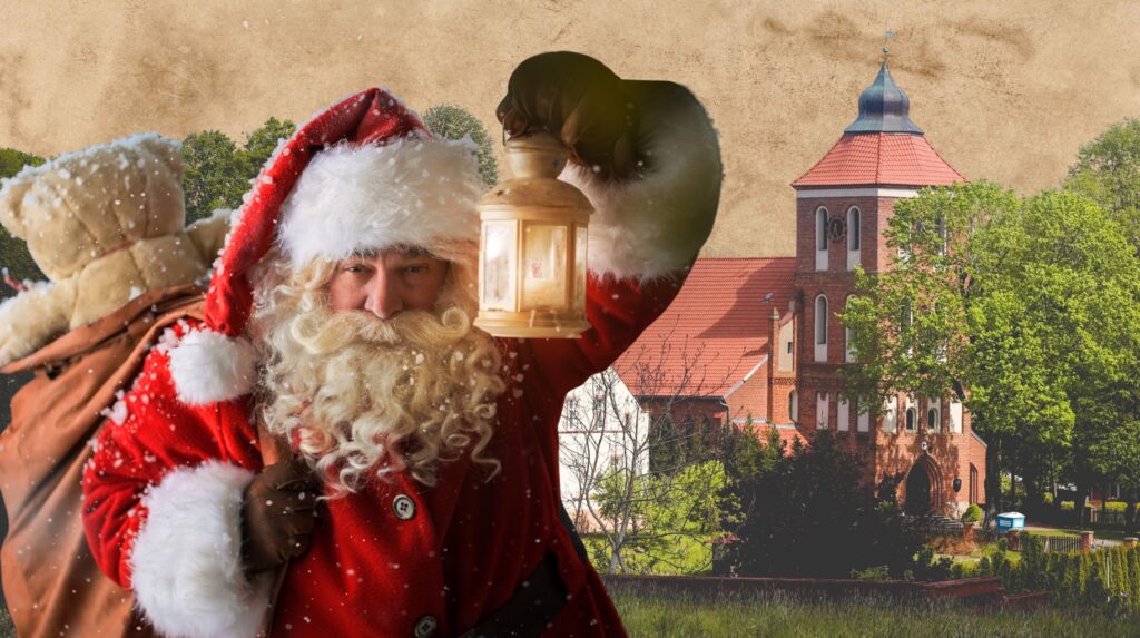 Mikołaj z latarnią na tle kościoła.