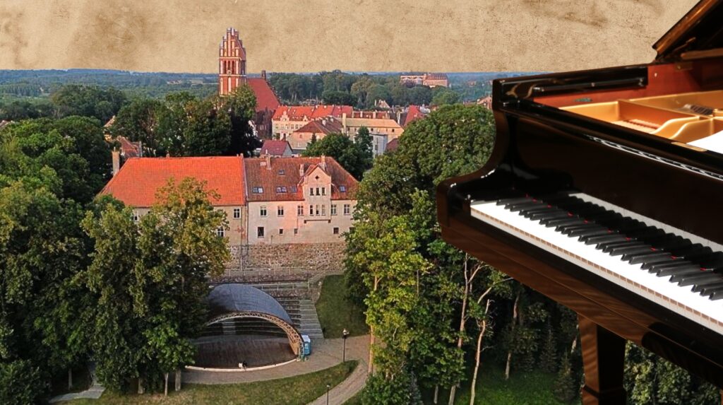 Widok na miasto z fortepianem w pierwszym planie.