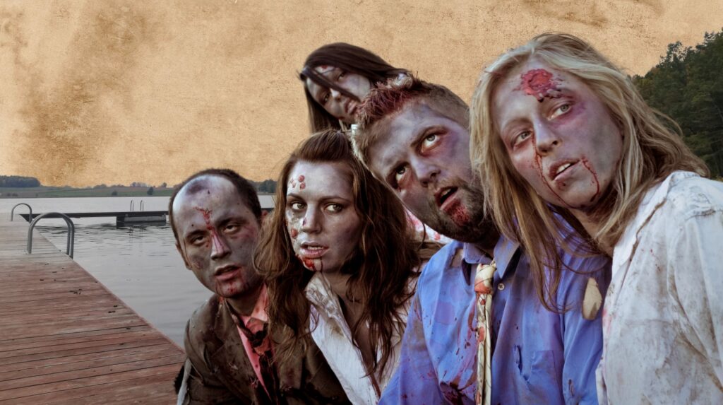 Grupa zombie pozująca przy jeziorze.