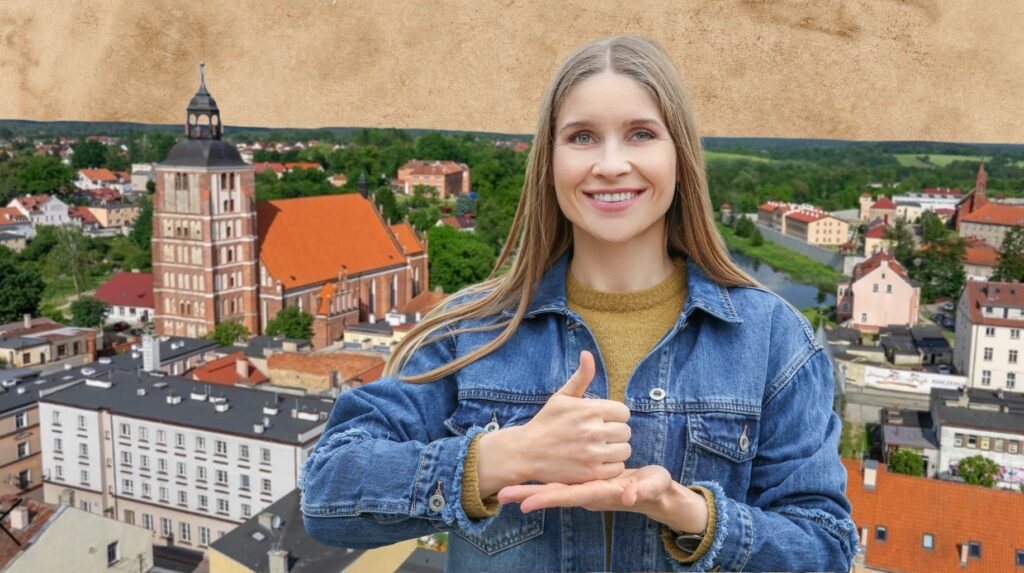 Młoda kobieta w dżinsowej kurtce z widokiem na miasto