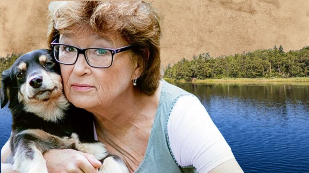 Kobieta przytulająca psa nad jeziorem