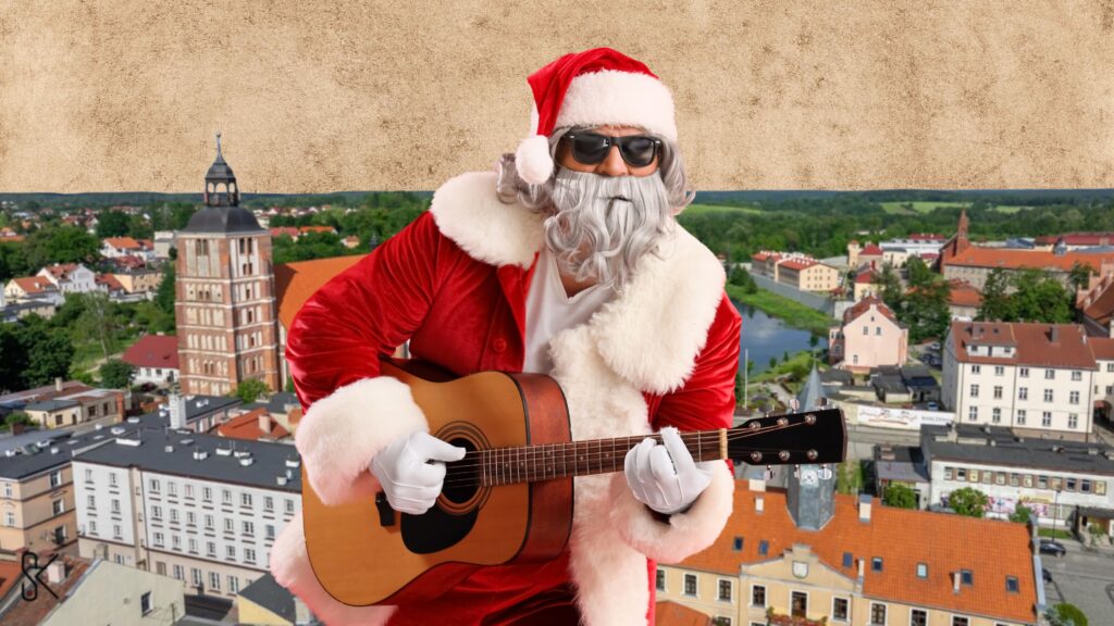 Mężczyzna w stroju Świętego Mikołaja gra na gitarze.