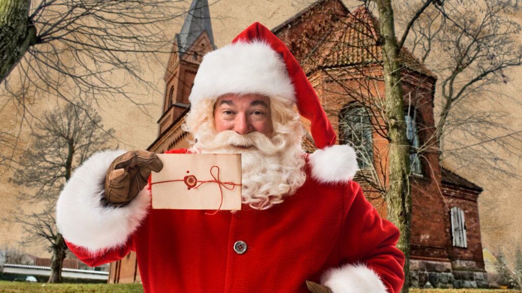 Mężczyzna przebrany za Świętego Mikołaja trzyma list.