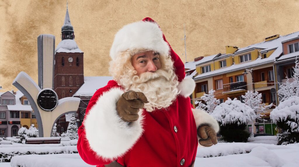 Mężczyzna przebrany za Świętego Mikołaja na tle zimowego krajobrazu.