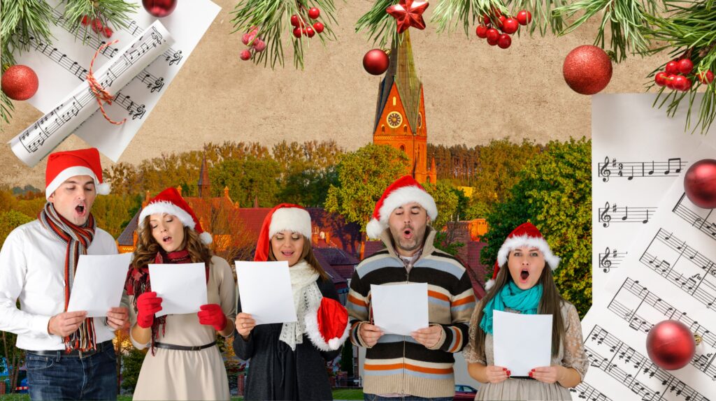 Grupa osób w czapkach Mikołaja śpiewa kolędy.