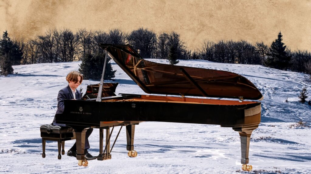 Chłopiec gra na fortepianie w zimowym krajobrazie.