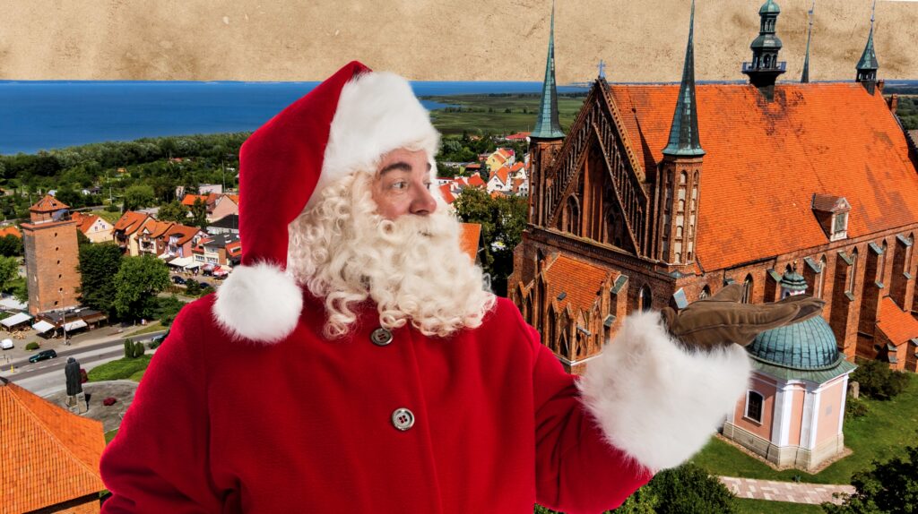 Mężczyzna w stroju Świętego Mikołaja z widokiem na miasto.