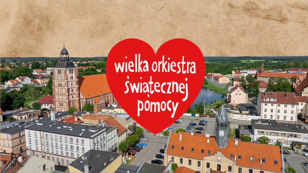 Widok na miasto z napisem o Wielkiej Orkiestrze Świątecznej Pomocy