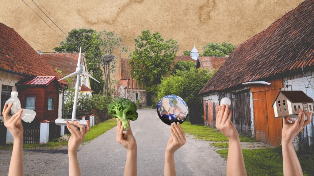 Ręce trzymają różne symbole zrównoważonego rozwoju.