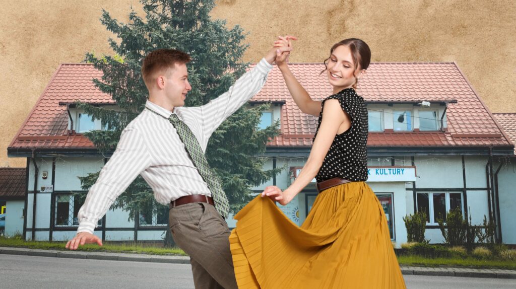 Para tańcząca na tle budynku.