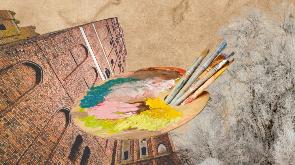 Paleta malarska z farbami i pędzlami na tle ceglanej ściany