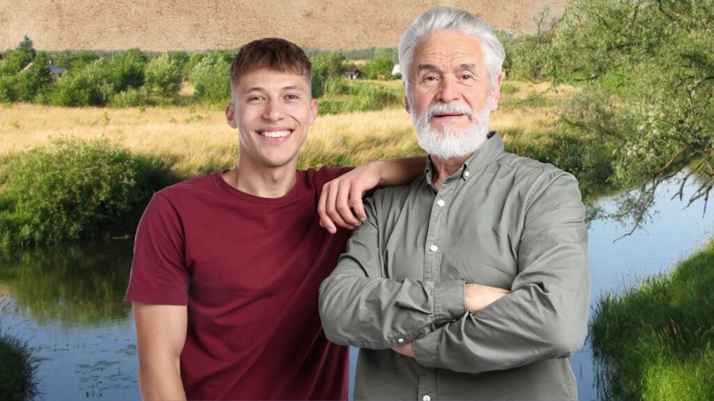 Dwaj mężczyźni, młody i starszy, pozujący wspólnie na tle krajobrazu z rzeki Łyny