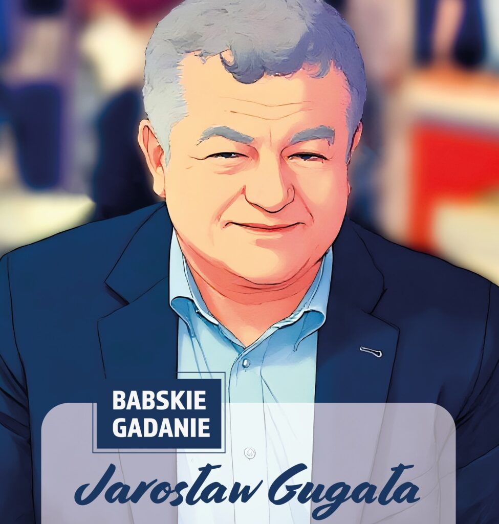 Mężczyzna uśmiechający się w garniturze.