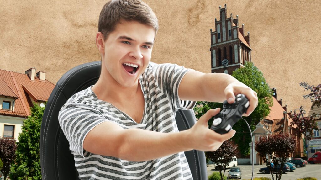 Młody mężczyzna gra na konsoli.