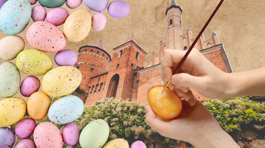Ręka malująca pisankę wśród kolorowych jajek