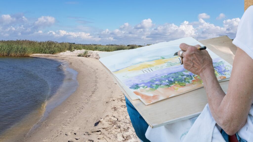 Artysta malujący krajobraz na plaży