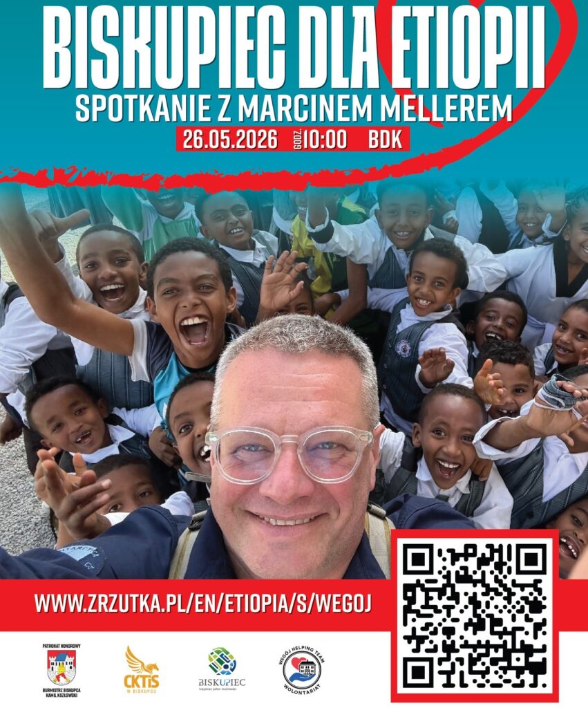 Osoba z uśmiechem na tle grupy dzieci, które radosne machają rękami.
