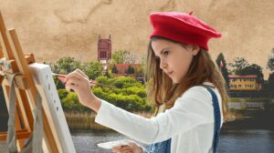 Dziewczynka maluje obraz na tle zieleni i budynków.
