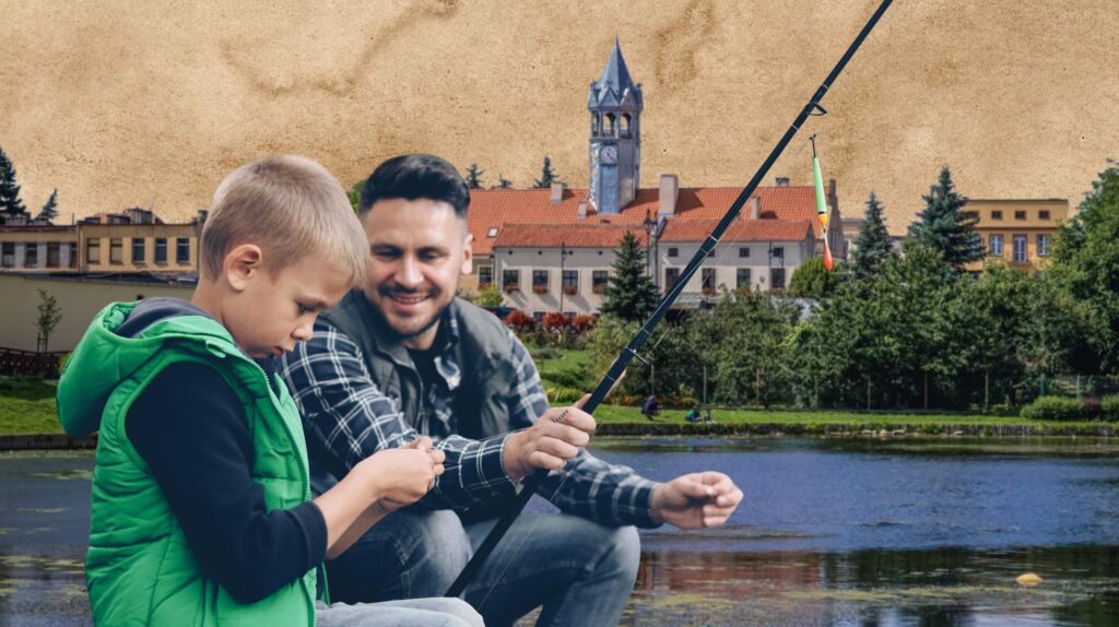 Ojciec wędkuje z synem nad jeziorem.