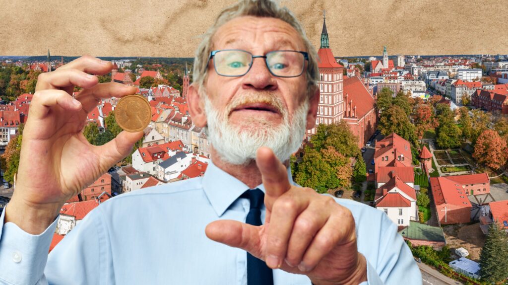 Mężczyzna trzyma monetę z widokiem na miasto.