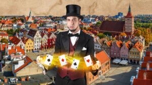 Mężczyzna w kapeluszu cylindrycznym trzyma karty w magicznej pozie.