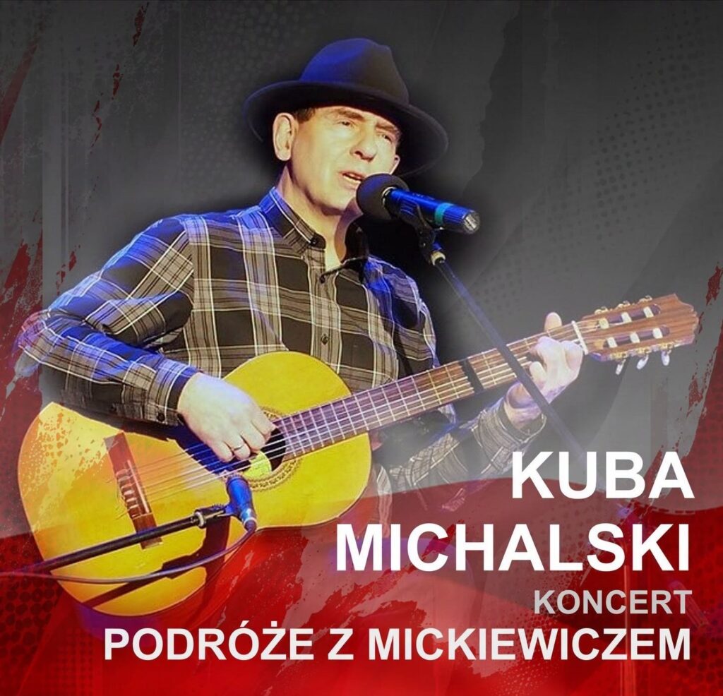 Mężczyzna grający na gitarze podczas koncertu.